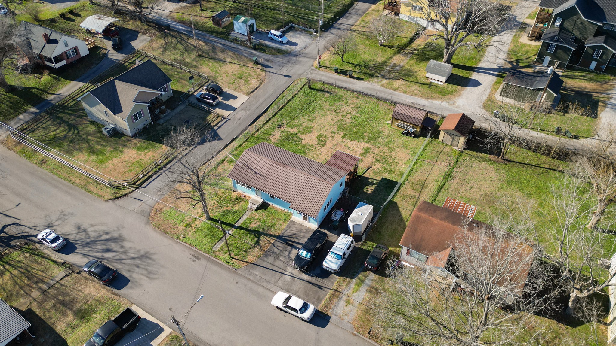 406 High Street Dickson, TN 37055 - Photo 17 of 24 an aerial view of a house with a garden and swimming pool