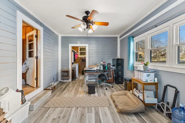a work room with furniture and windows