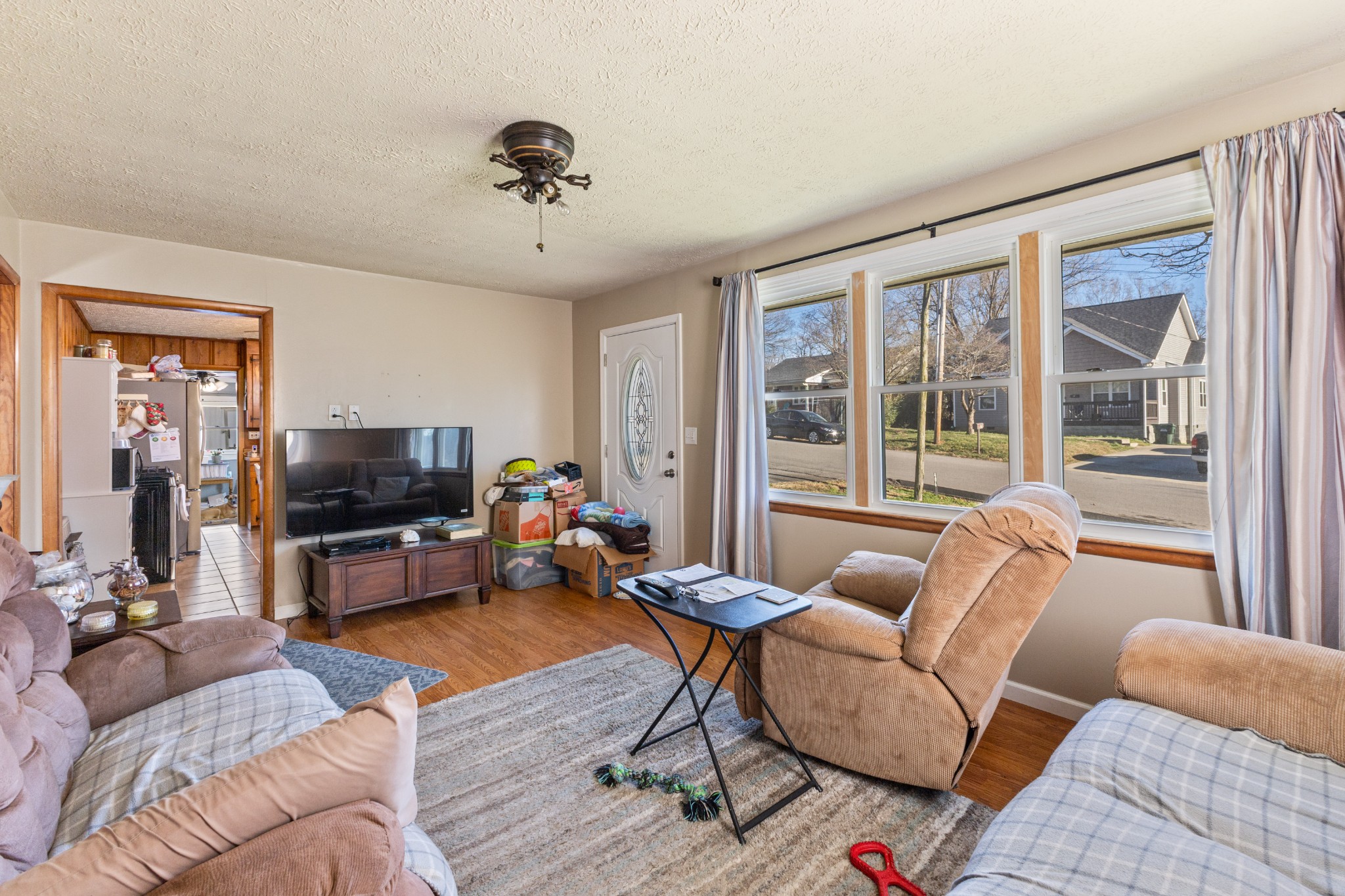 406 High Street Dickson, TN 37055 - Photo 6 of 24 a living room with furniture and a flat screen tv