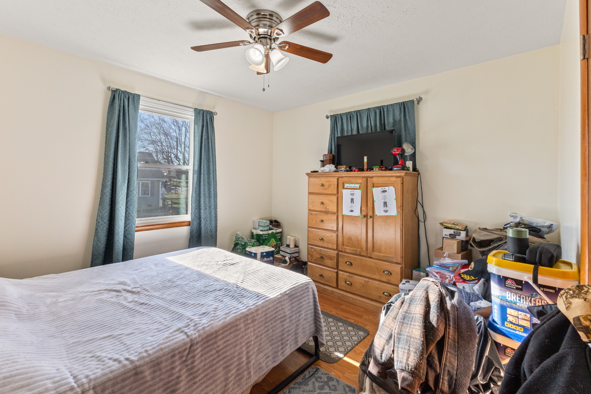 406 High Street Dickson, TN 37055 - Photo 8 of 24 a bedroom with a bed and a mirror