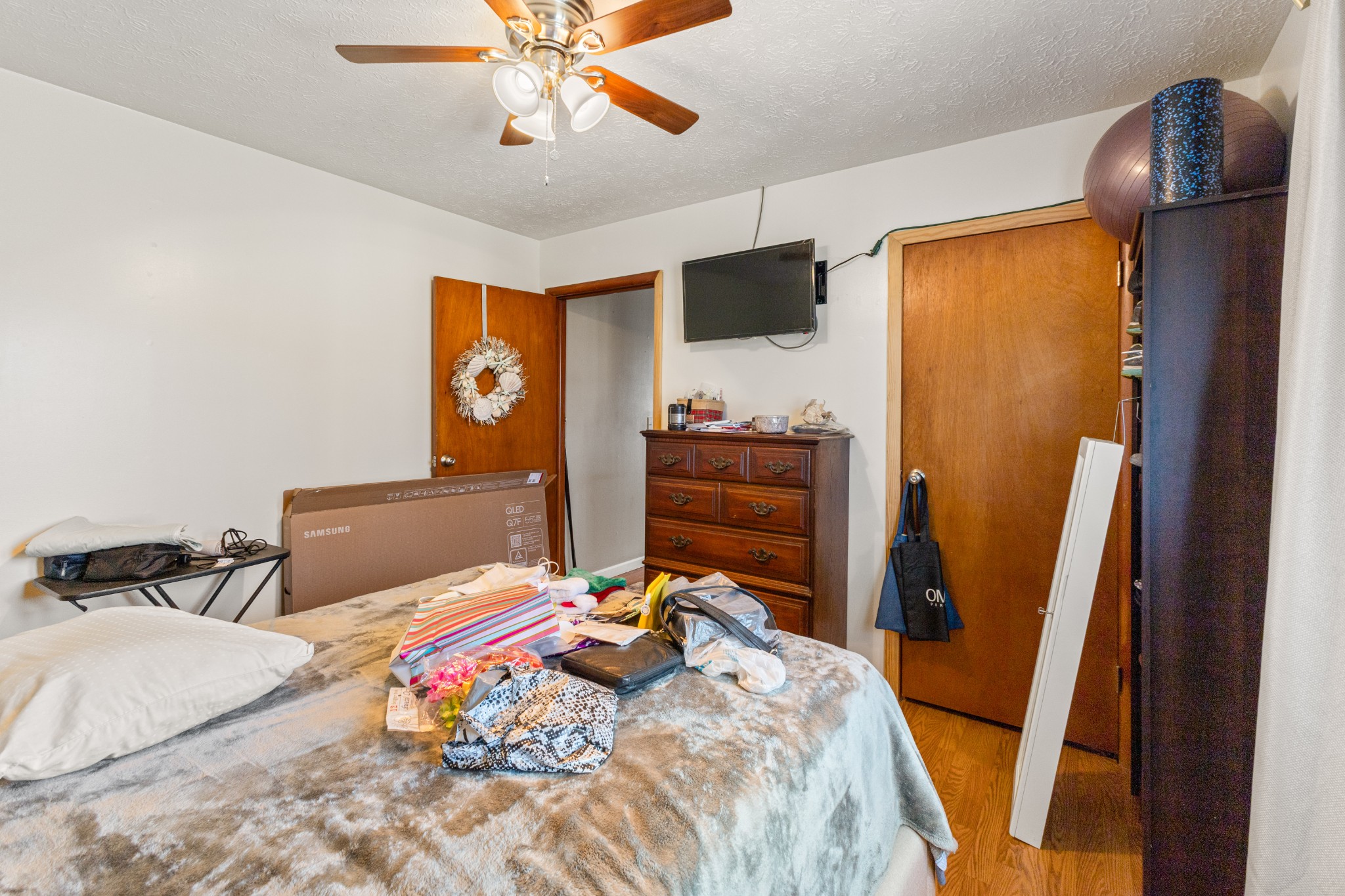 406 High Street Dickson, TN 37055 - Photo 10 of 24 a bedroom with a bed and wooden floor