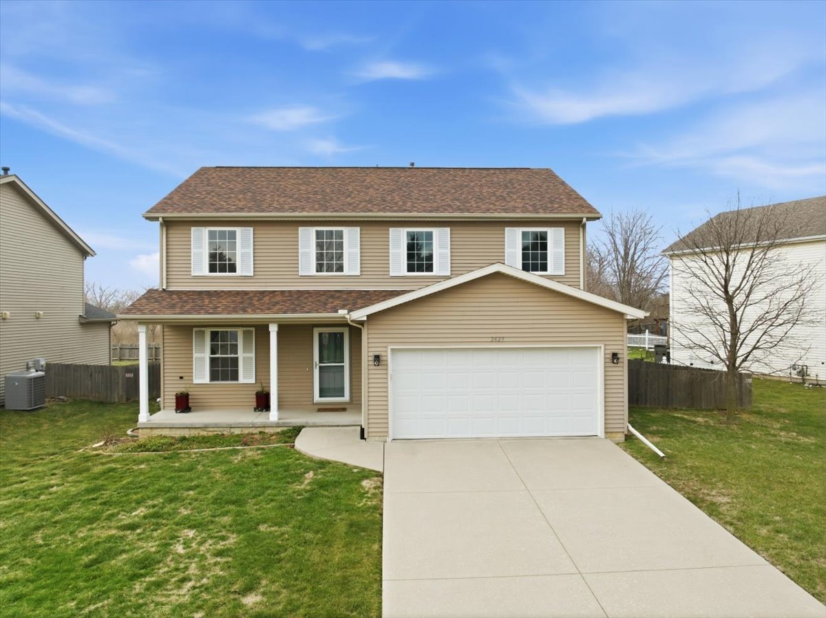 2429 Grey Fox Trail Bloomington, IL 61705 - Photo 1 of 43 a front view of a house with garden
