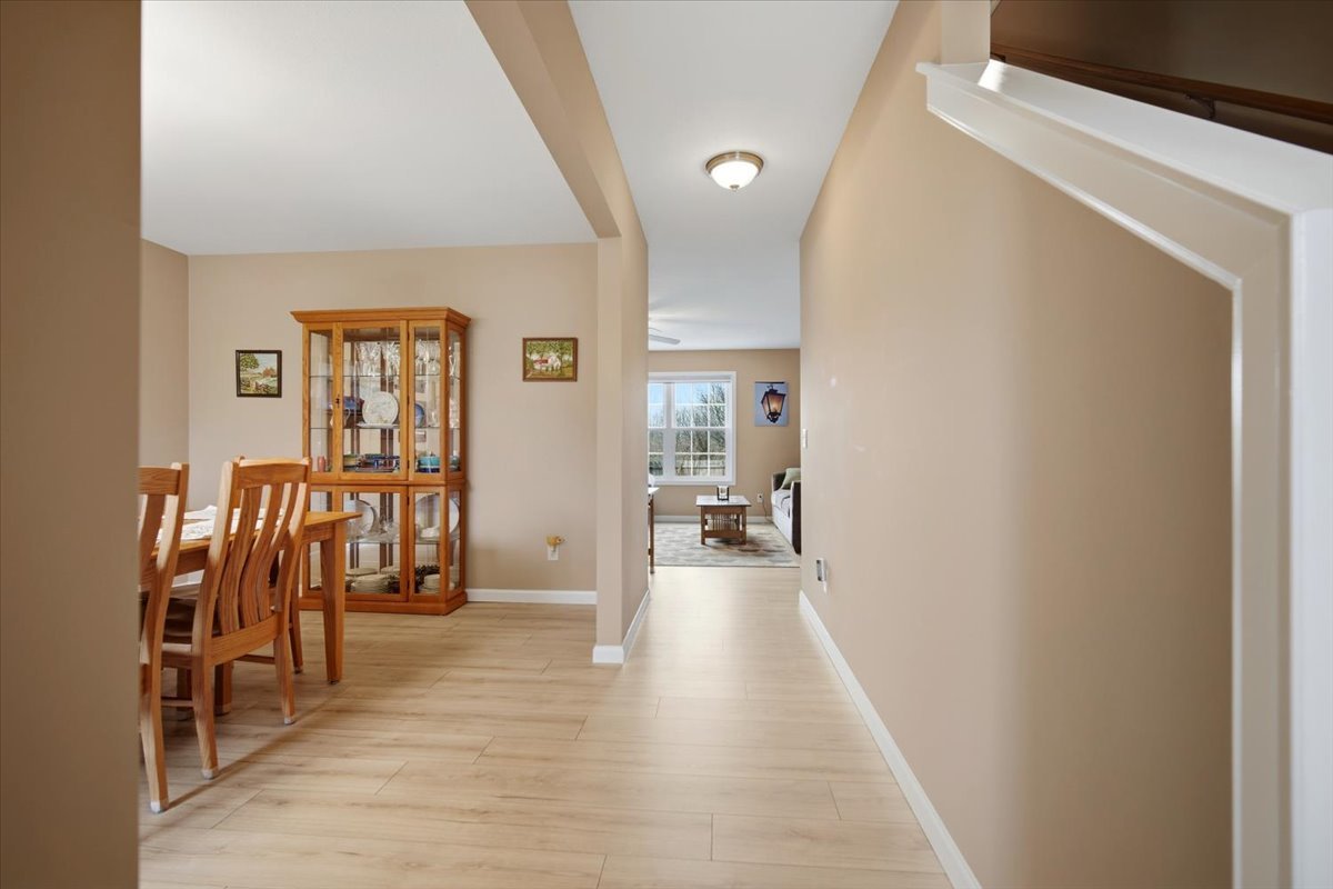 2429 Grey Fox Trail Bloomington, IL 61705 - Photo 15 of 43 a view of a hallway with wooden floor