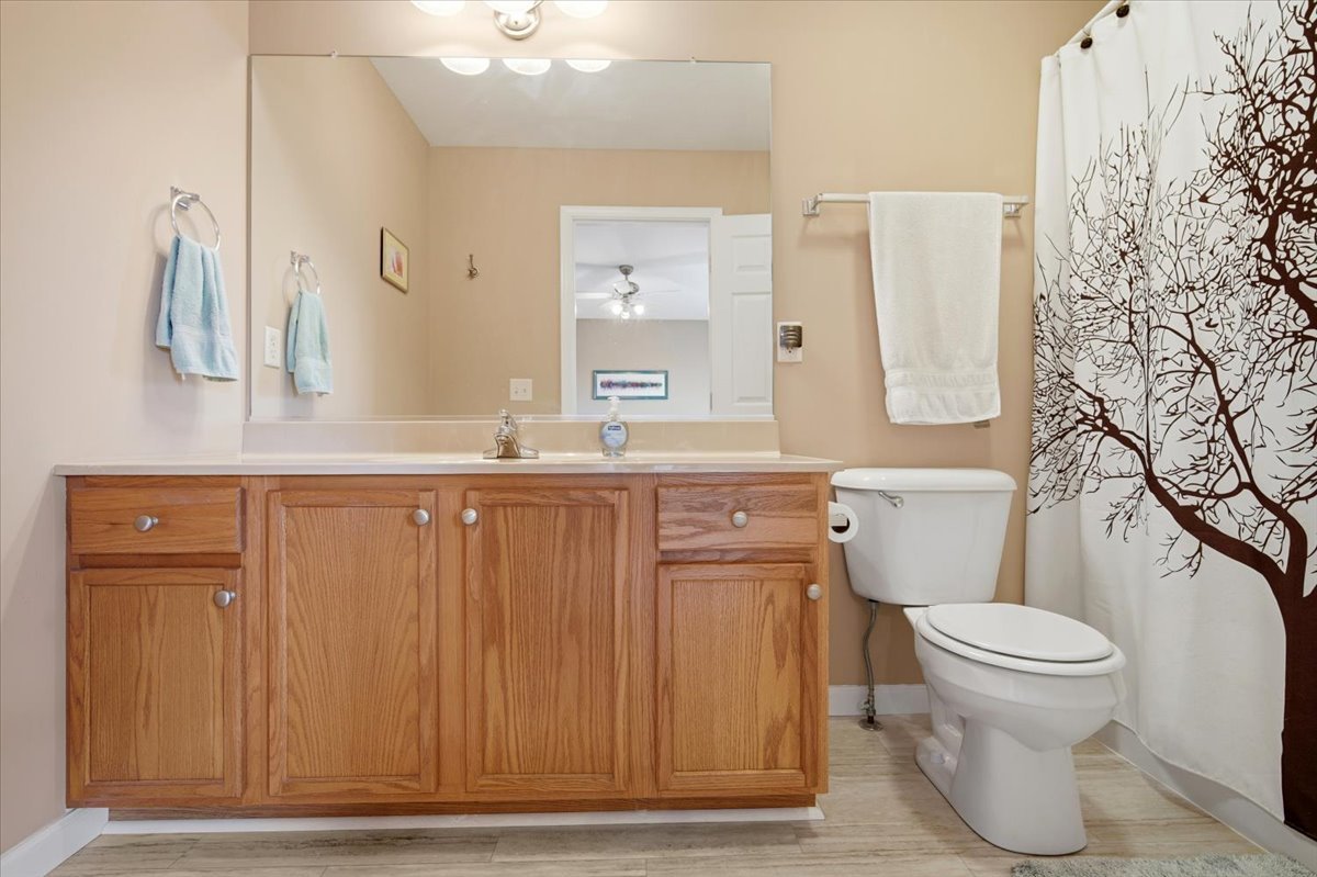 2429 Grey Fox Trail Bloomington, IL 61705 - Photo 20 of 43 a bathroom with a toilet a sink and a mirror