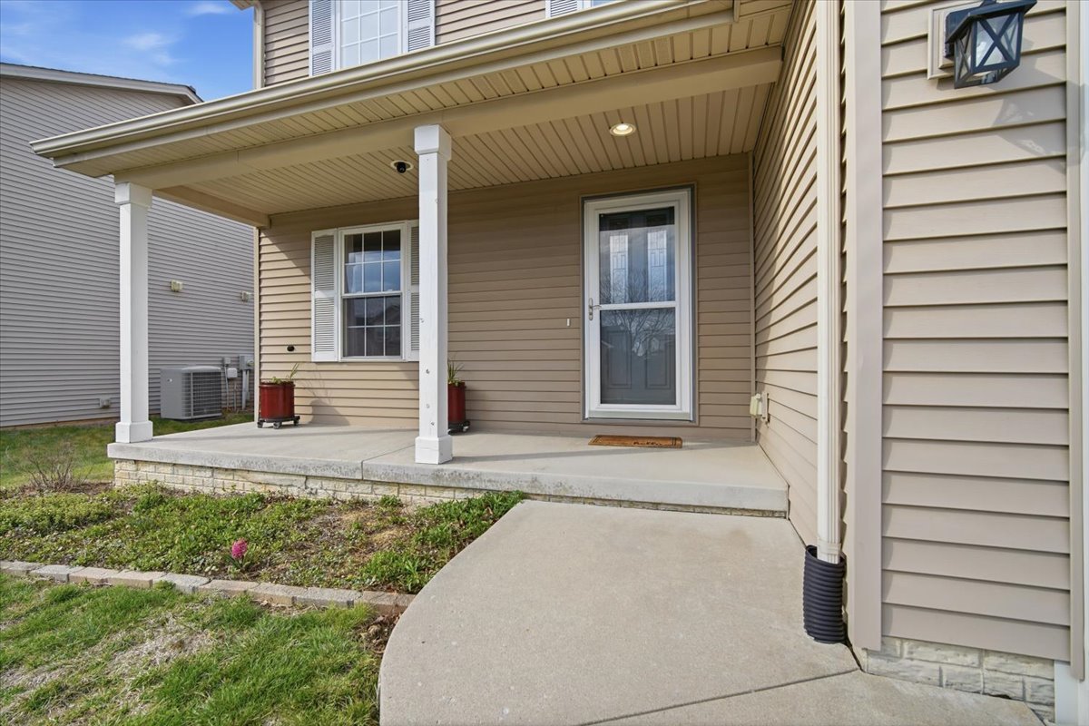 2429 Grey Fox Trail Bloomington, IL 61705 - Photo 2 of 43 a front view of a house with garden