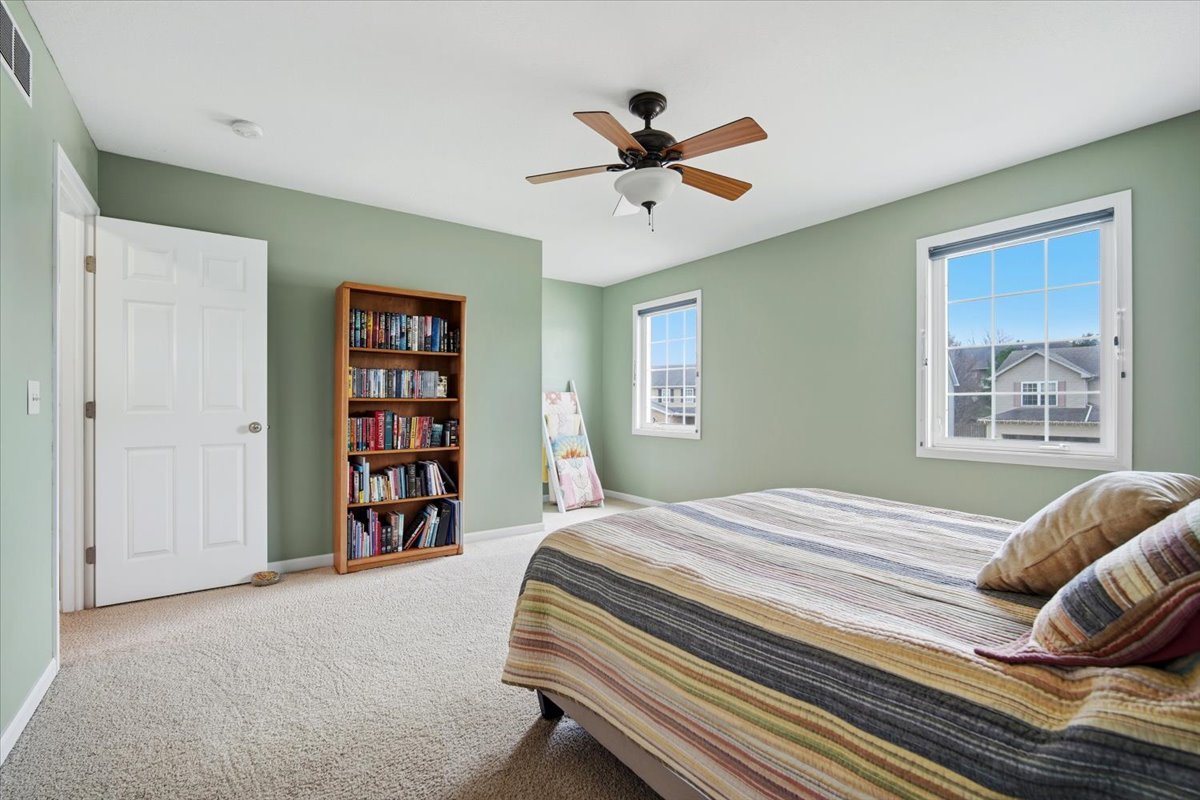 2429 Grey Fox Trail Bloomington, IL 61705 - Photo 22 of 43 a bedroom with a bed and a window