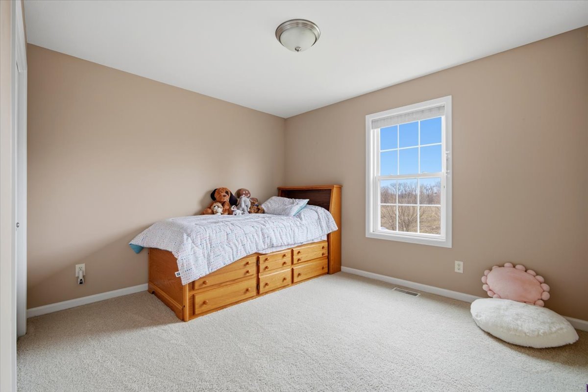 2429 Grey Fox Trail Bloomington, IL 61705 - Photo 23 of 43 a bed room with a bed and a window
