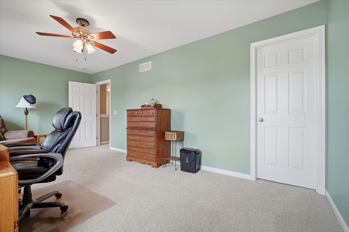 2429 Grey Fox Trail Bloomington, IL 61705 - Photo 25 of 43 a work room with furniture and a ceiling fan