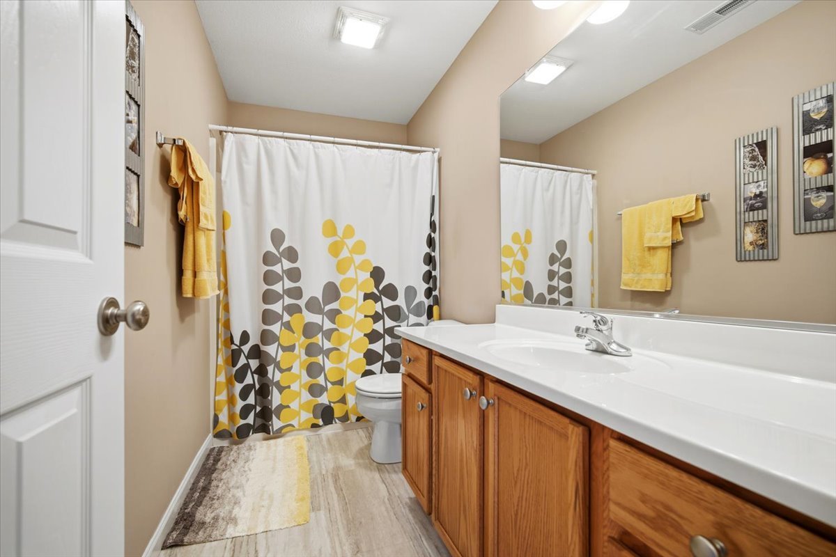 2429 Grey Fox Trail Bloomington, IL 61705 - Photo 26 of 43 a bathroom with a double vanity sink and mirror