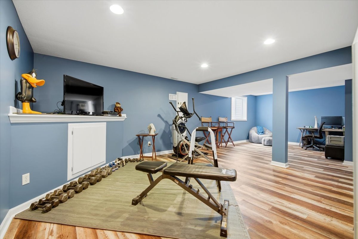 2429 Grey Fox Trail Bloomington, IL 61705 - Photo 27 of 43 a living room with furniture and a wooden floor