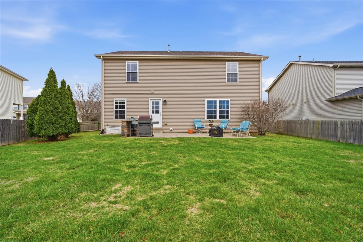 2429 Grey Fox Trail Bloomington, IL 61705 - Photo 33 of 43 a view of a house with backyard and sitting area