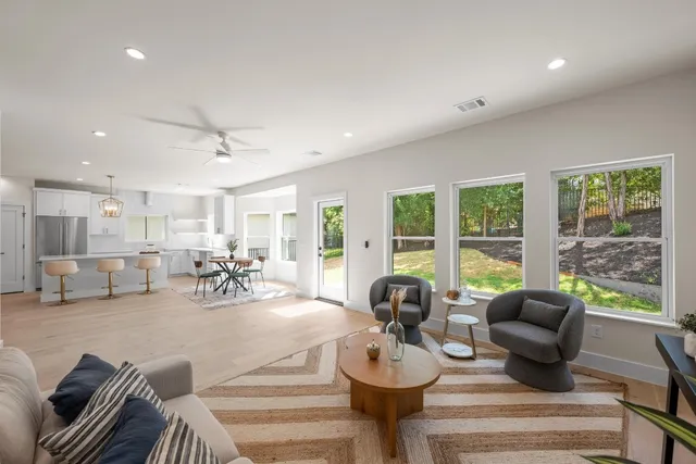 a very nice looking living room with furniture and a large window