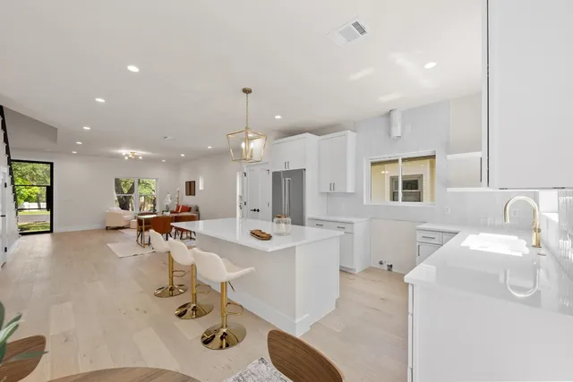 a view of a dining hall with furniture and a chandelier