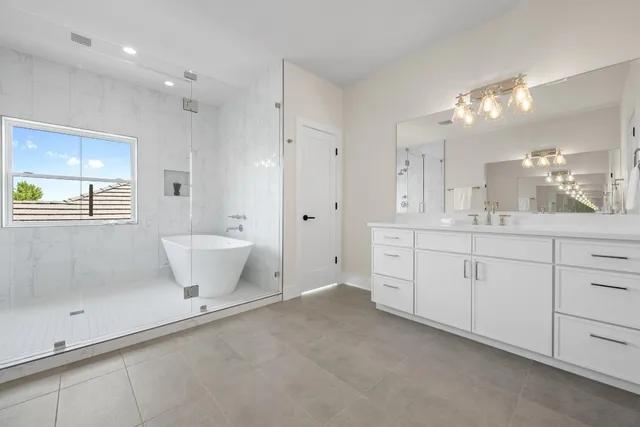 a bathroom with a bathtub and shower