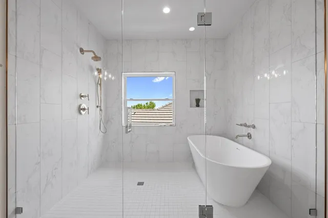 a white bath tub sitting in a bathroom