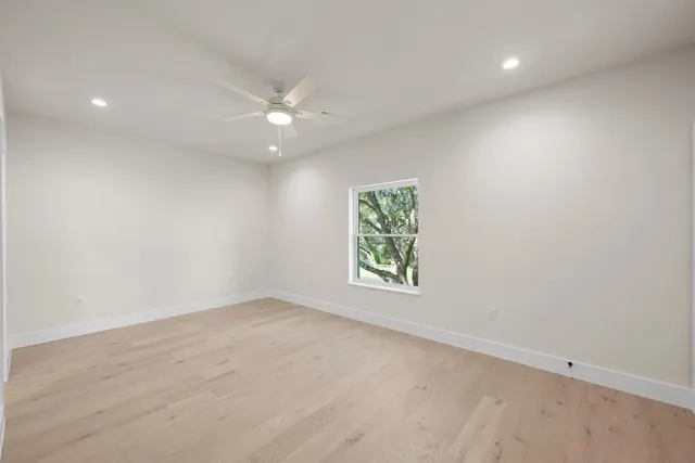 a bathroom with a double vanity sink toilet and shower