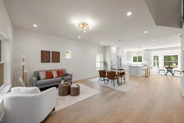 a living room with furniture and a table