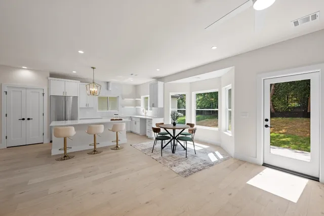 a view of a dining room with furniture window and outside view