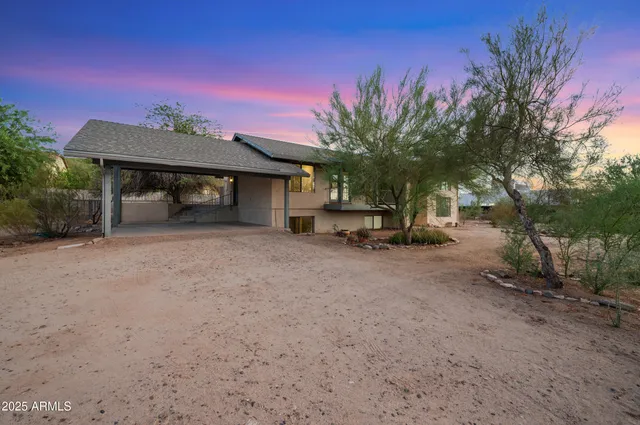 a view of a kitchen with a sink and a refrigerator