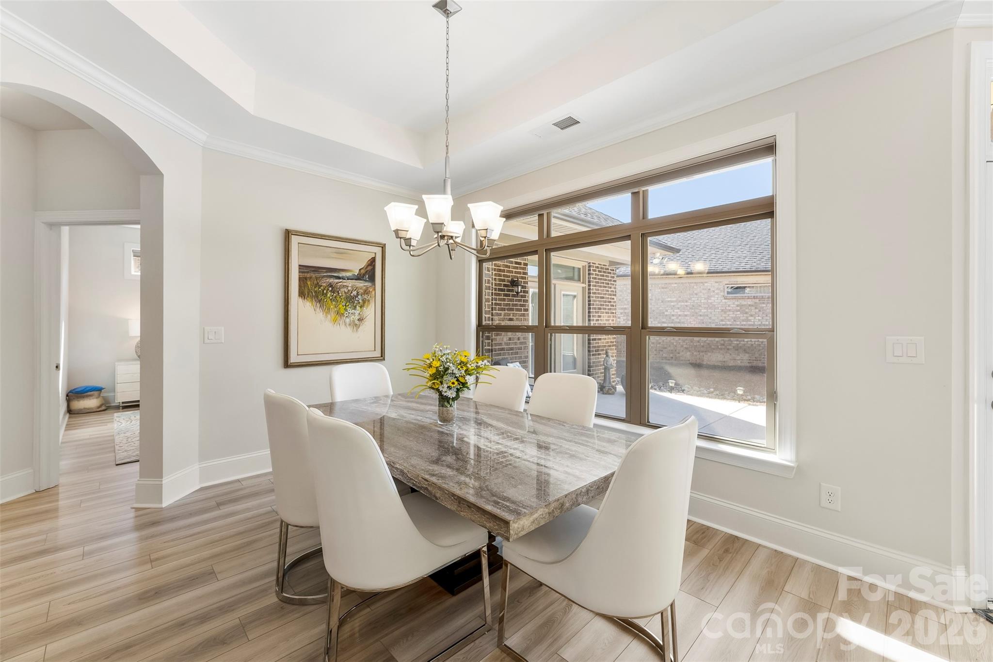 2014 New Style Way Fort Mill, SC 29708 - Photo 11 of 43 a view of a dining room with furniture a chandelier and wooden floor