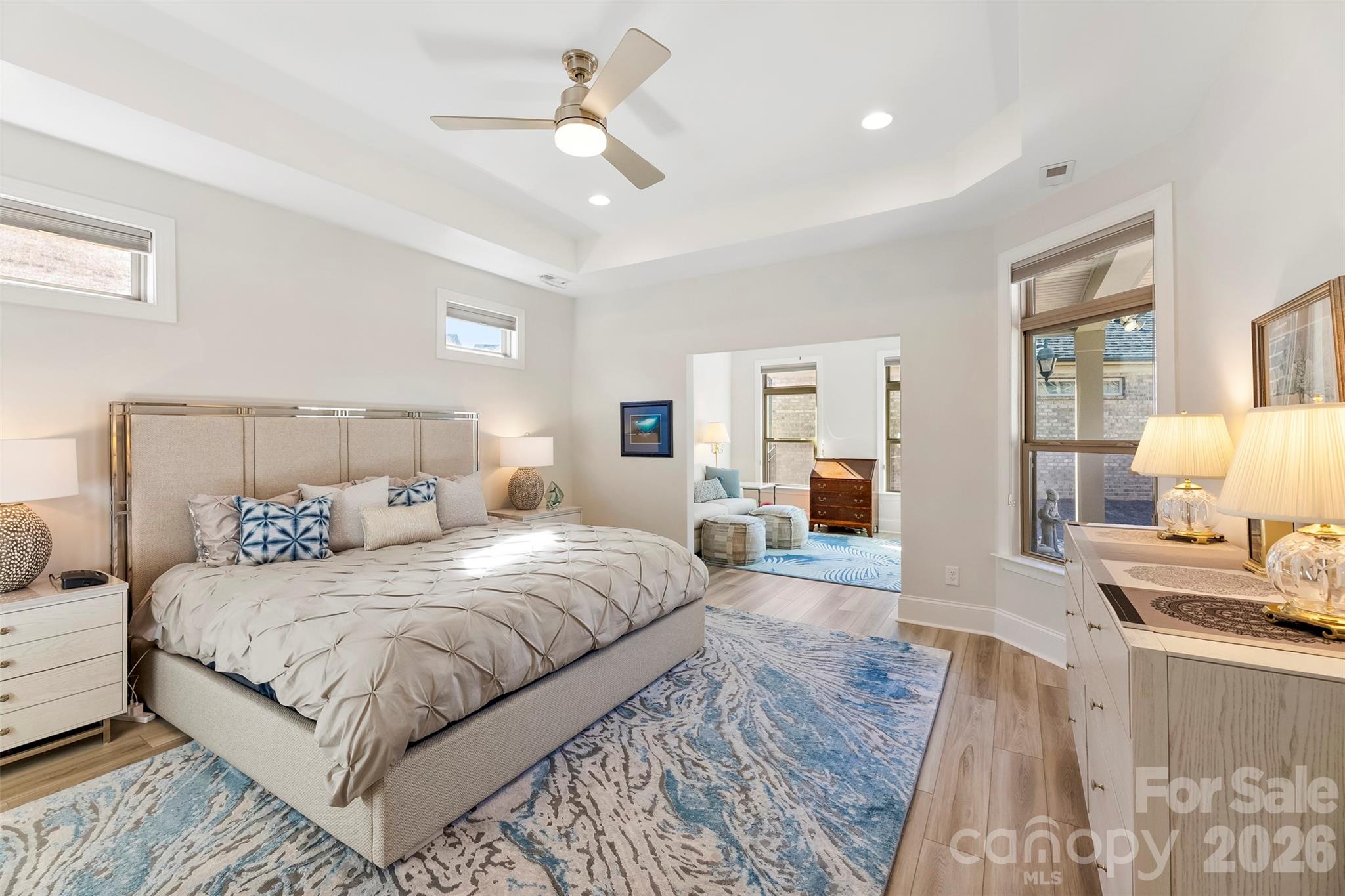 2014 New Style Way Fort Mill, SC 29708 - Photo 17 of 43 a bedroom with a large bed and a chandelier