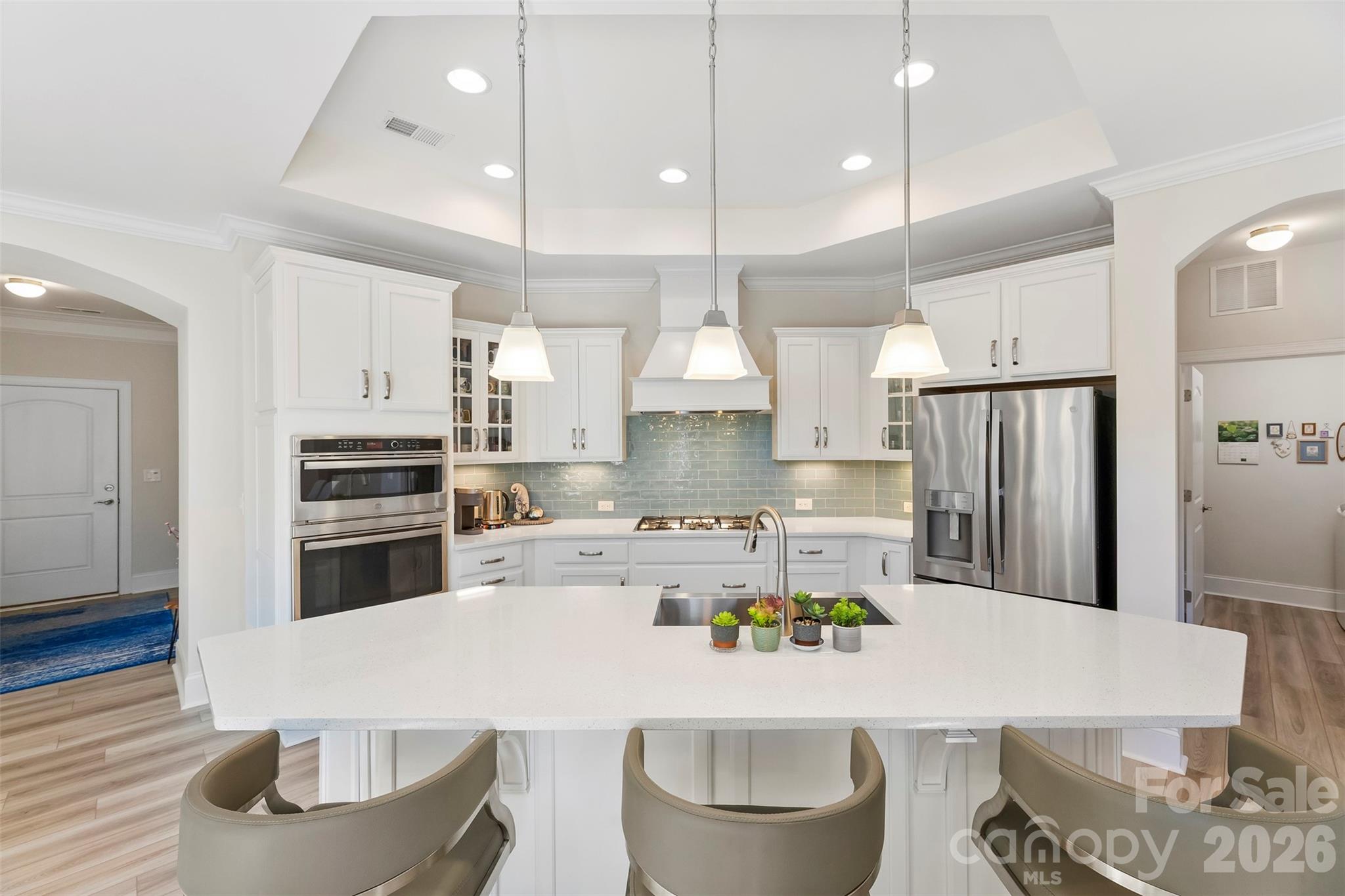 2014 New Style Way Fort Mill, SC 29708 - Photo 6 of 43 a kitchen with a dining table chairs wooden floor and appliances