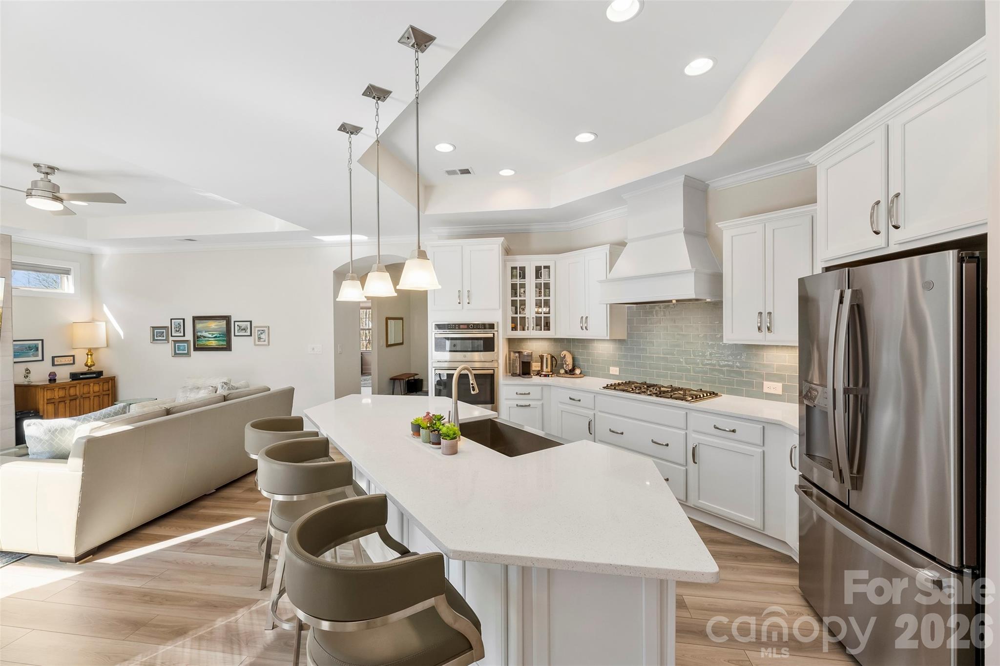 2014 New Style Way Fort Mill, SC 29708 - Photo 7 of 43 a kitchen with white cabinets and stainless steel appliances