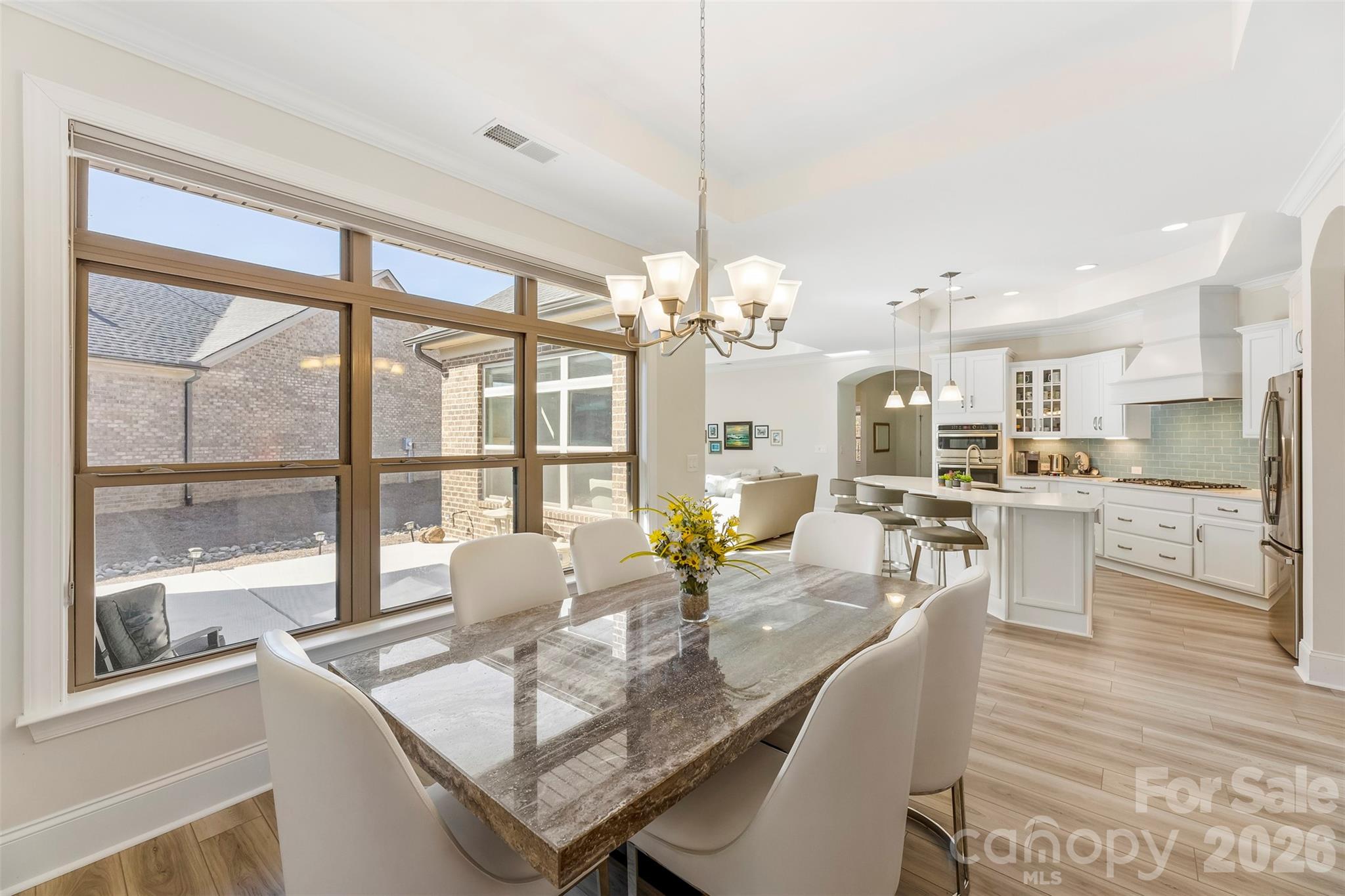 2014 New Style Way Fort Mill, SC 29708 - Photo 8 of 43 a dining room with furniture a chandelier and wooden floor