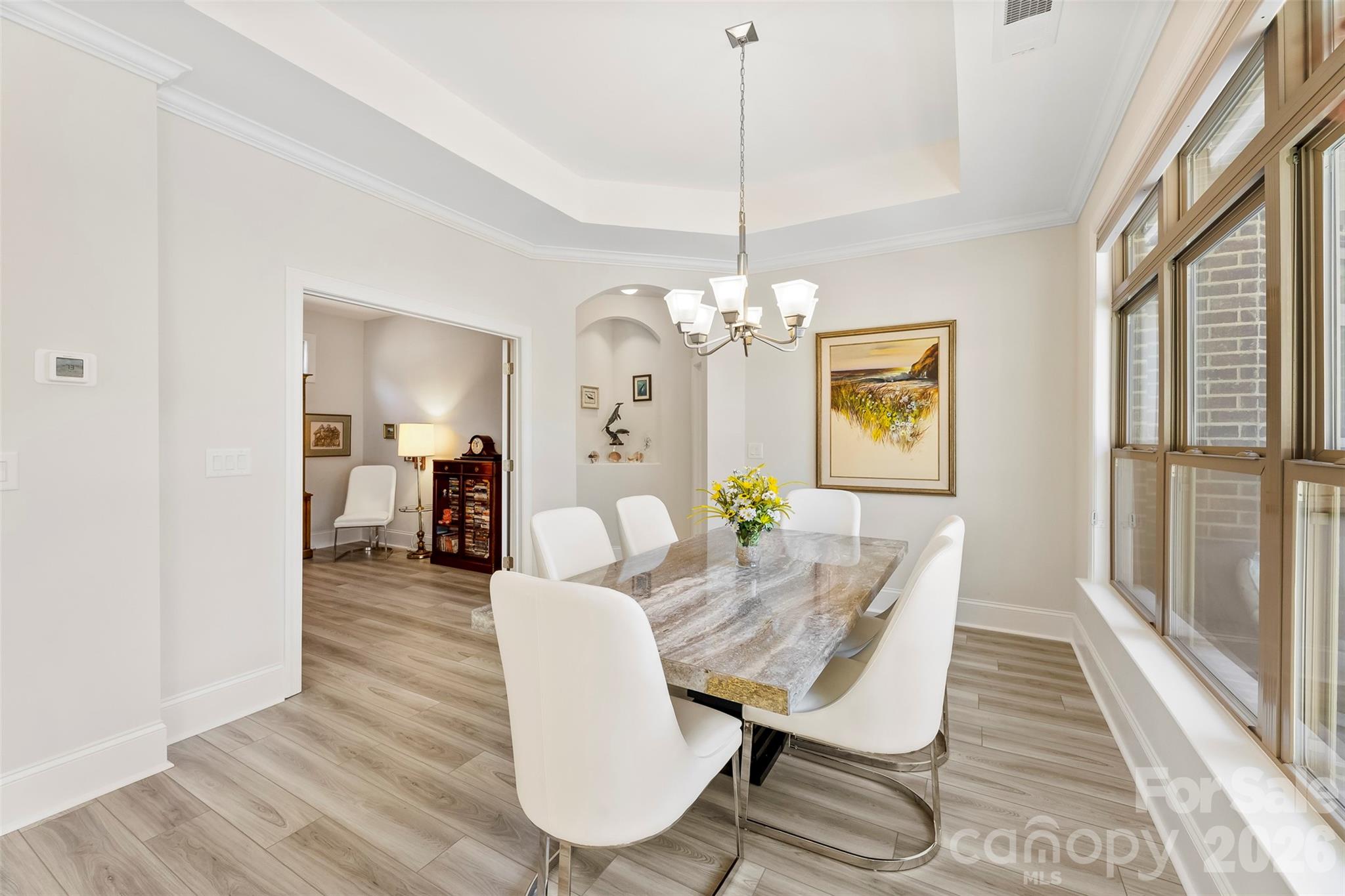 2014 New Style Way Fort Mill, SC 29708 - Photo 10 of 43 a view of a dining room with furniture a chandelier and wooden floor