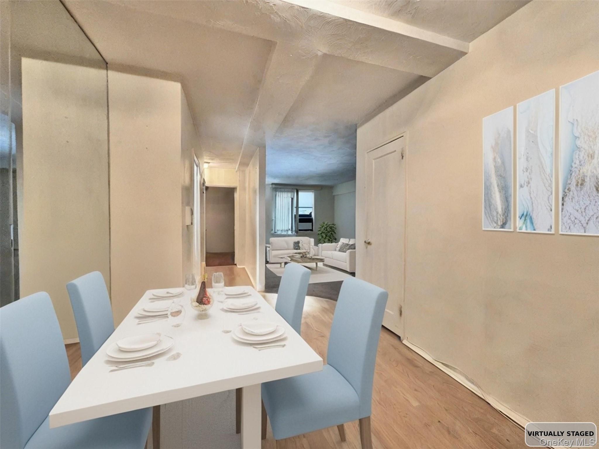 140-14 28th Road, Unit 1A Queens, NY 11354 - Photo 3 of 8 a dining room with furniture and window