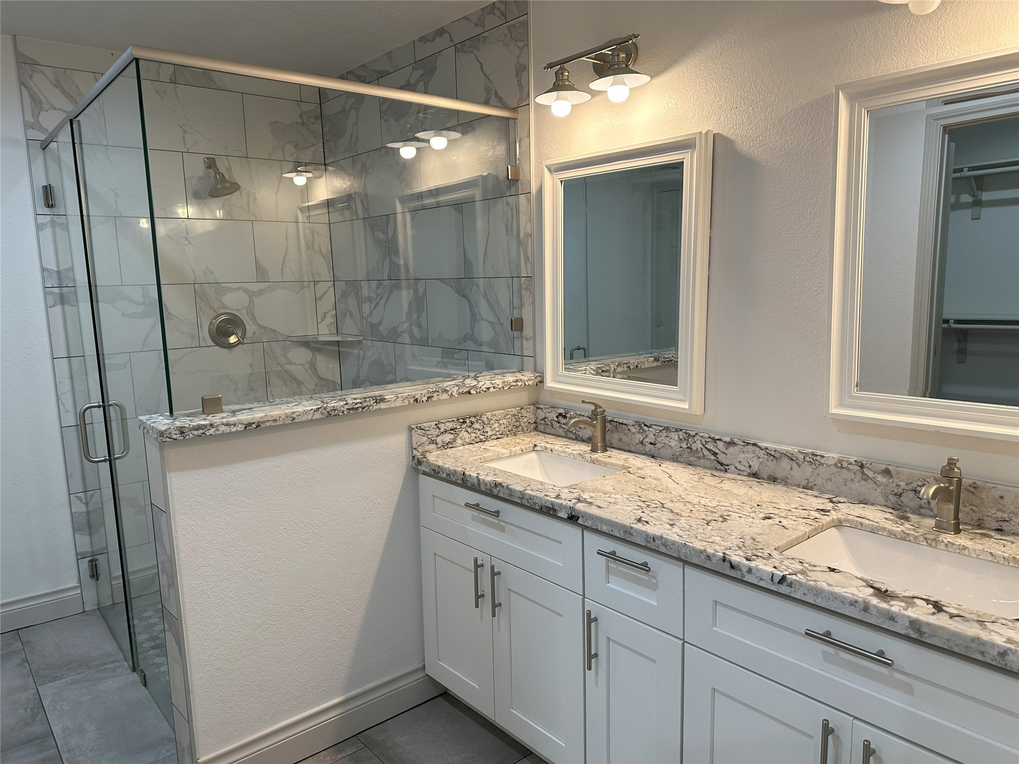 6646 Limestone Street Houston, TX 77092 - Photo 15 of 23 a bathroom with a granite countertop sink mirror and double