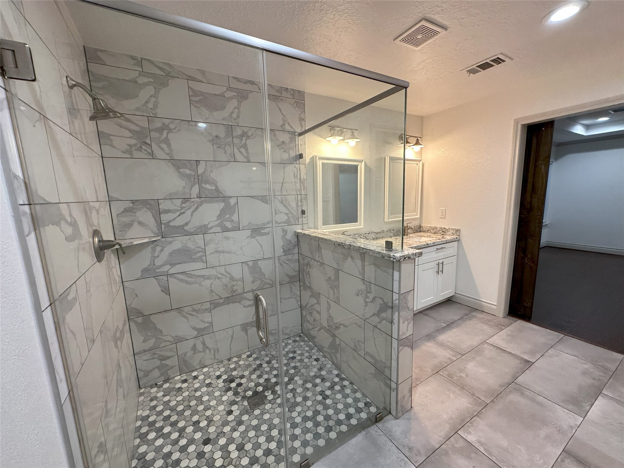 6646 Limestone Street Houston, TX 77092 - Photo 16 of 23 a bathroom with a shower