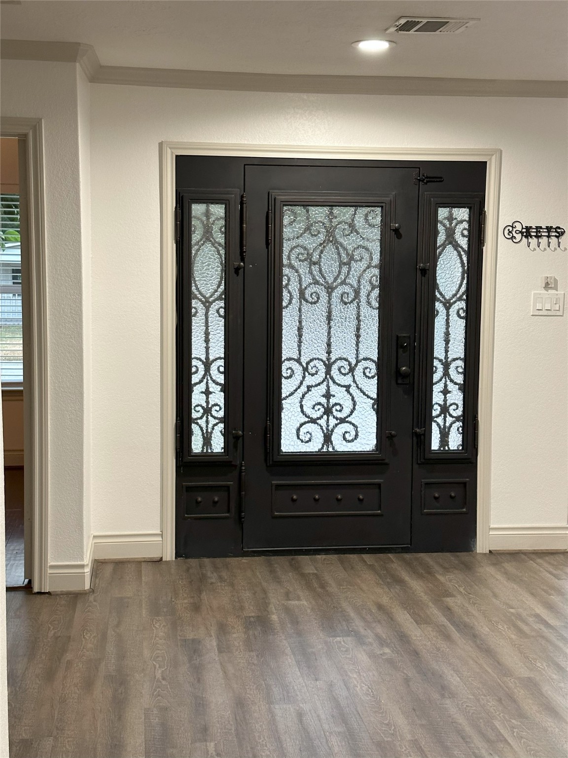 6646 Limestone Street Houston, TX 77092 - Photo 17 of 23 wooden floor and windows in the room