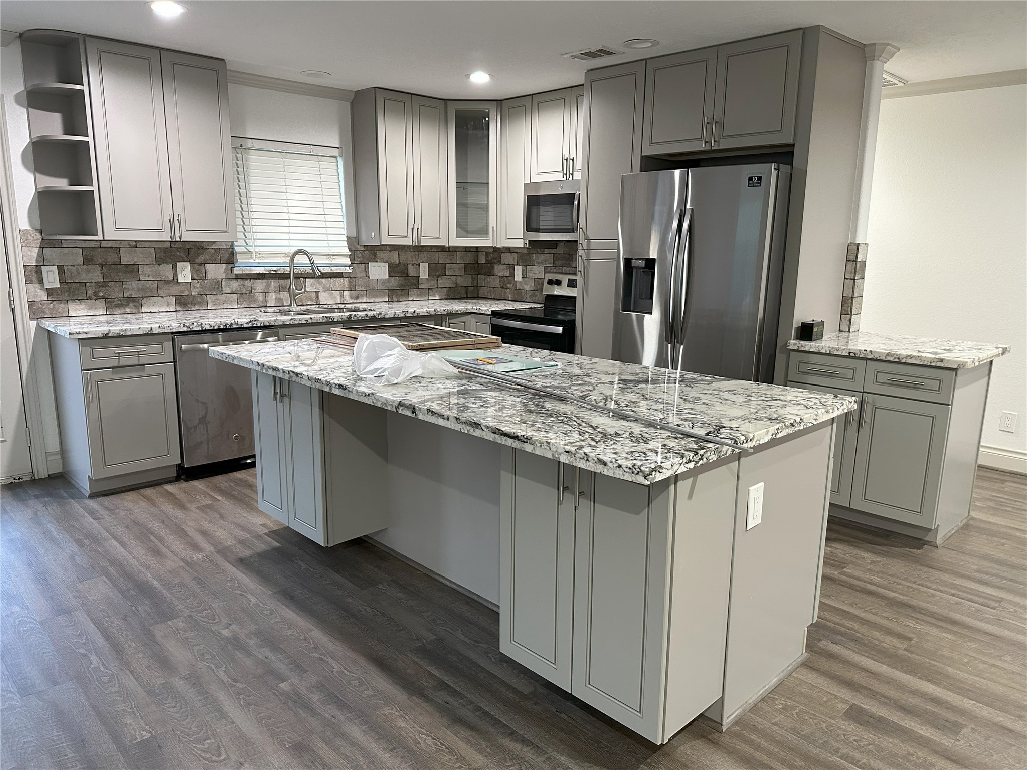 6646 Limestone Street Houston, TX 77092 - Photo 18 of 23 a kitchen with stainless steel appliances granite countertop a sink stove refrigerator and cabinets