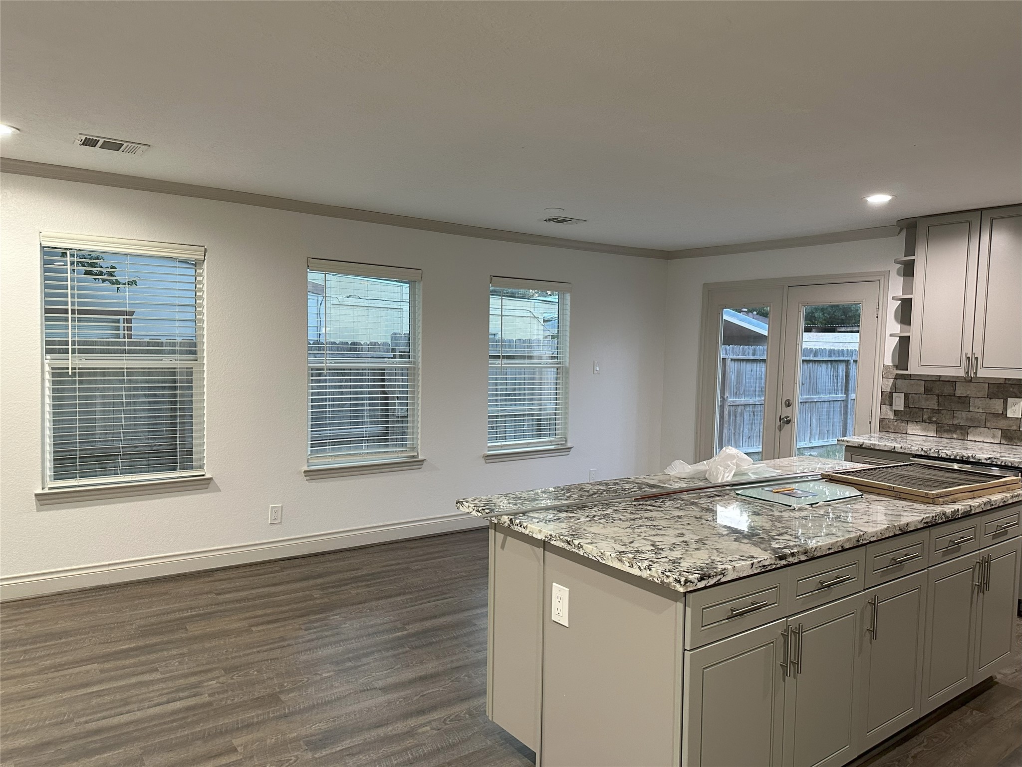 6646 Limestone Street Houston, TX 77092 - Photo 19 of 23 a kitchen with granite countertop sink and stove