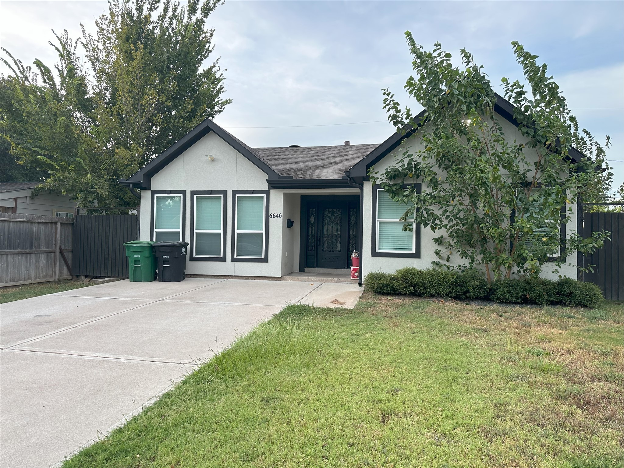 6646 Limestone Street Houston, TX 77092 - Photo 23 of 23 a view of a house with a yard and large tree