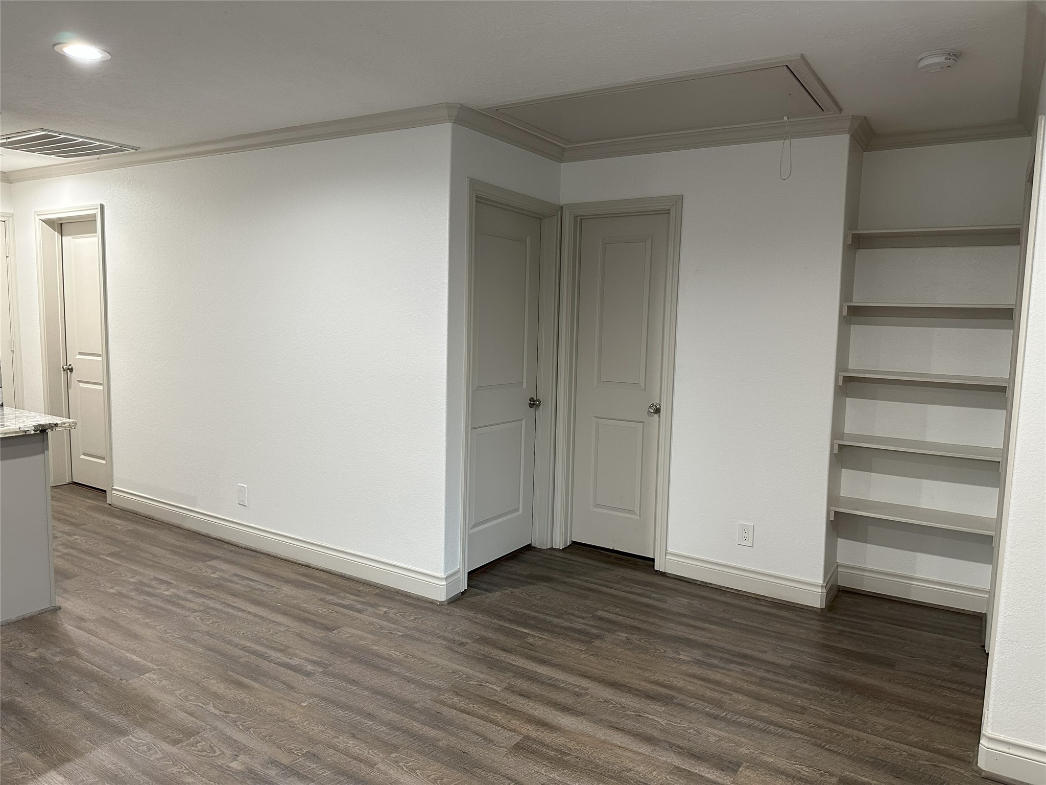 6646 Limestone Street Houston, TX 77092 - Photo 9 of 23 a view of an empty room with wooden floor and closet