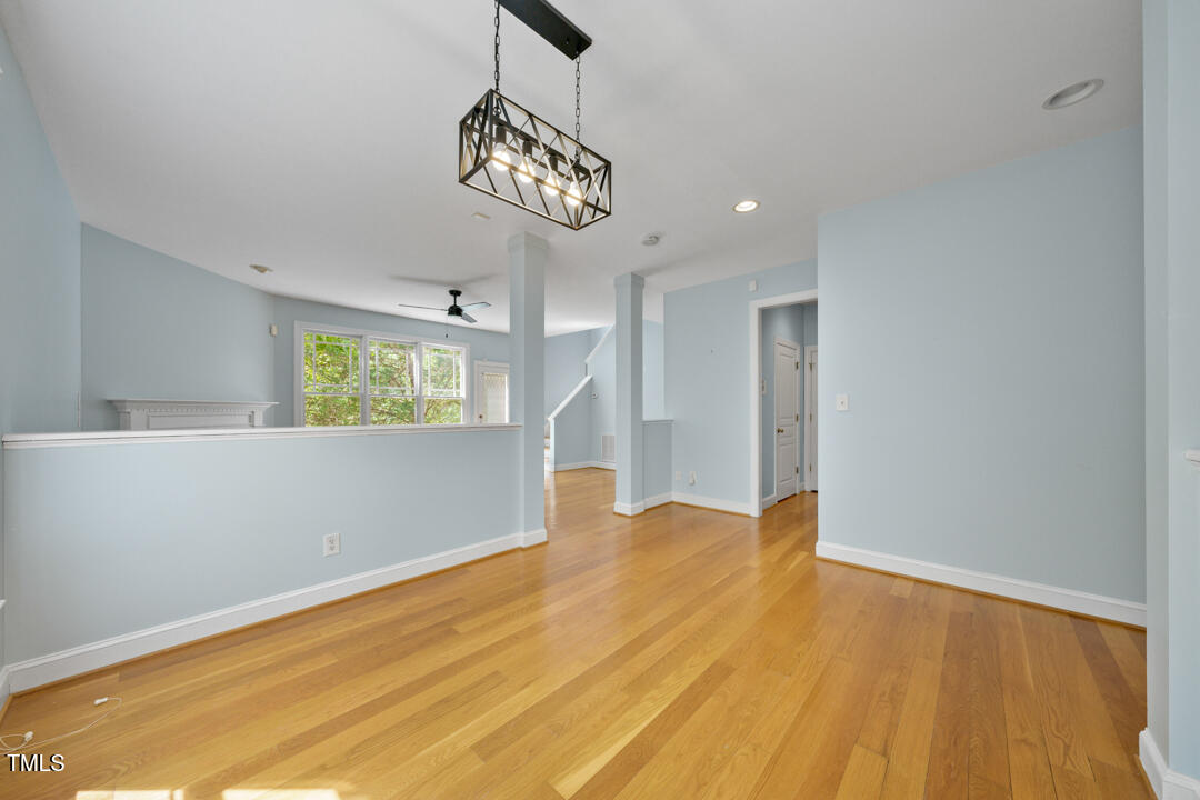203 Bluefield Road Chapel Hill, NC 27517 - Photo 14 of 34 a view of an empty room with wooden floor and a window