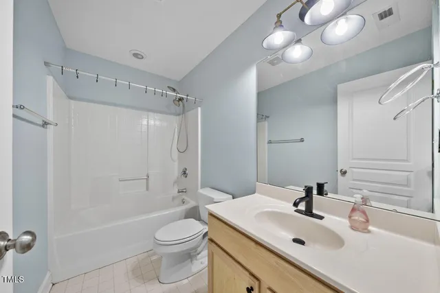 a bathroom with a sink toilet tub and shower