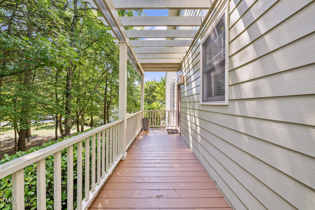 203 Bluefield Road Chapel Hill, NC 27517 - Photo 28 of 34 a view of a porch with wooden floor and stairs