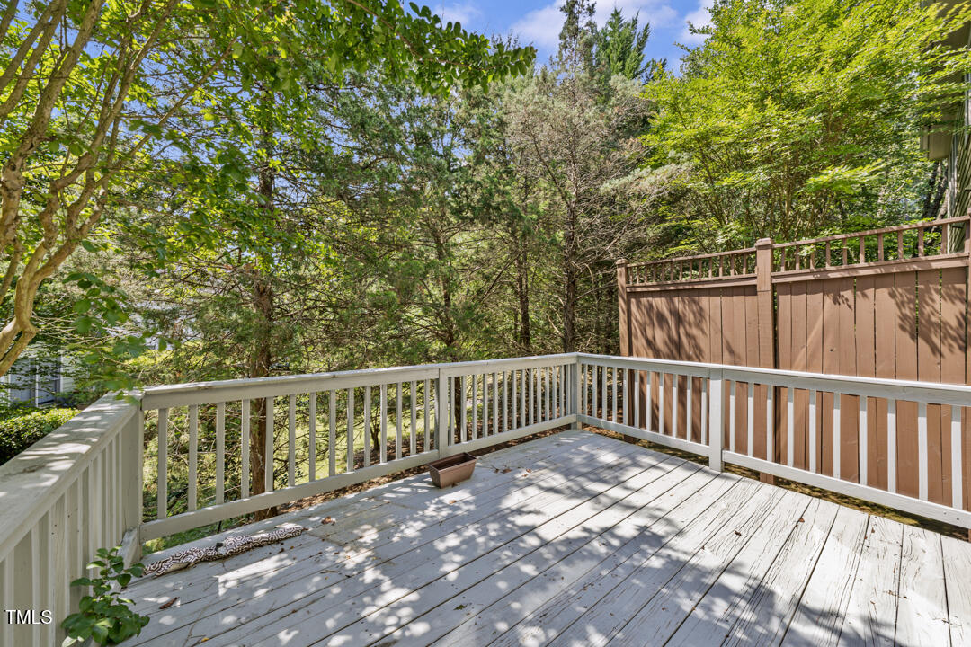 203 Bluefield Road Chapel Hill, NC 27517 - Photo 29 of 34 a balcony with wooden floor and fence