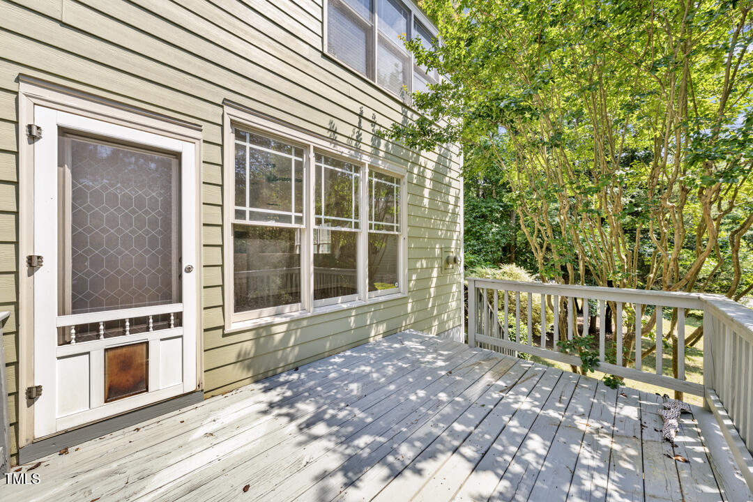 203 Bluefield Road Chapel Hill, NC 27517 - Photo 30 of 34 a view of a balcony with wooden floor and fence
