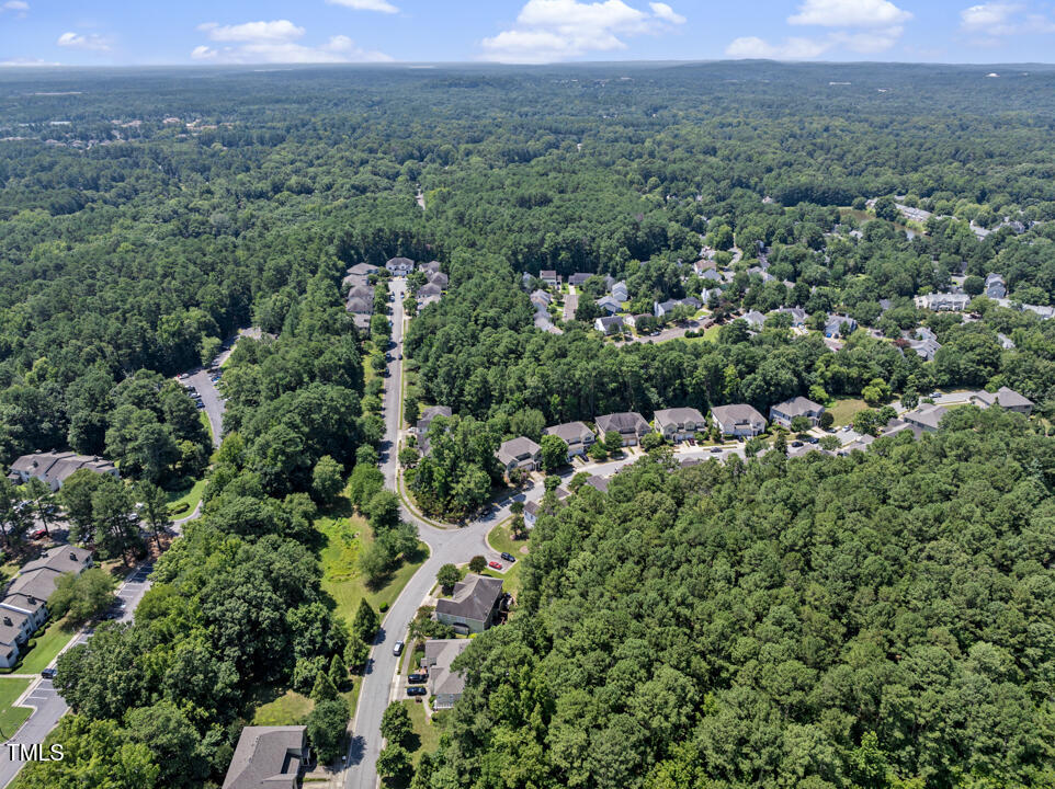 203 Bluefield Road Chapel Hill, NC 27517 - Photo 33 of 34 an aerial view of a city with lots of residential buildings and mountain view in back