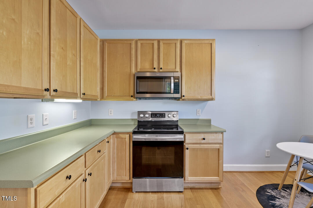 203 Bluefield Road Chapel Hill, NC 27517 - Photo 7 of 34 a kitchen with a stove and a microwave