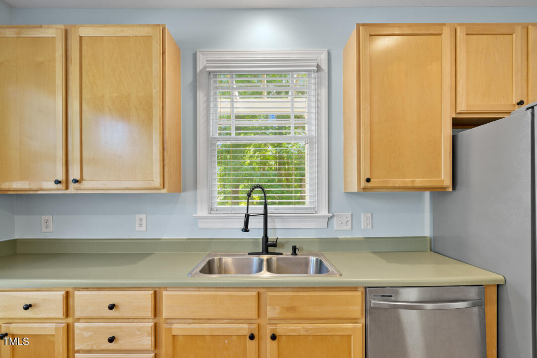 203 Bluefield Road Chapel Hill, NC 27517 - Photo 8 of 34 a kitchen with a sink and a window