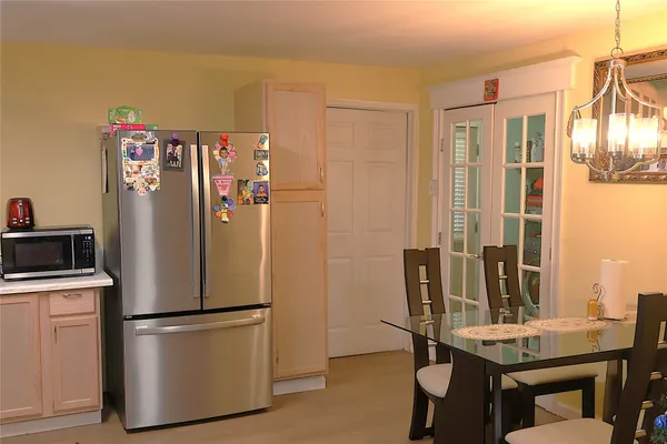 a view of a kitchen with appliances and cabinets