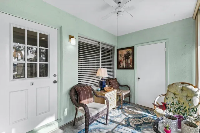 a outdoor dining room with furniture and window