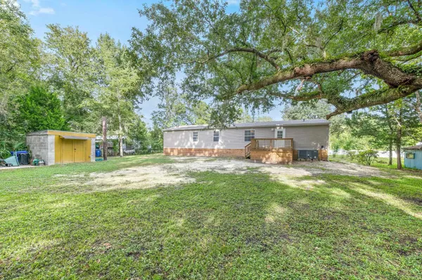 a view of a house with a back yard