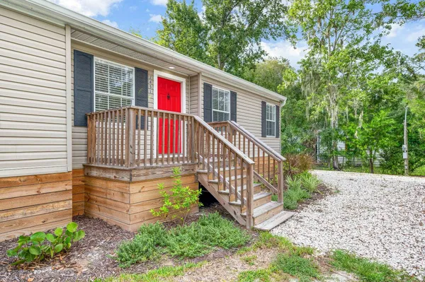 a kitchen with a stove a sink and a refrigerator