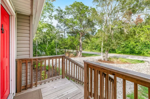 a kitchen with a sink a stove and a wooden floors
